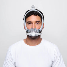 Man wearing F30i Mask, he is wearing a white t shirt and is standing infront of a white background