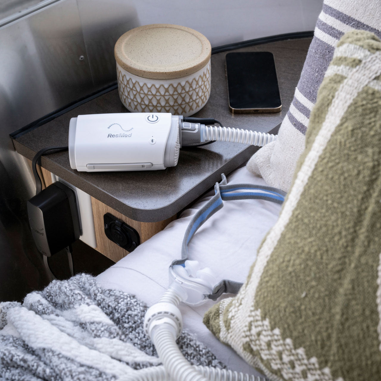 ResMed AirMini Automatic CPAP Device size compared to phone